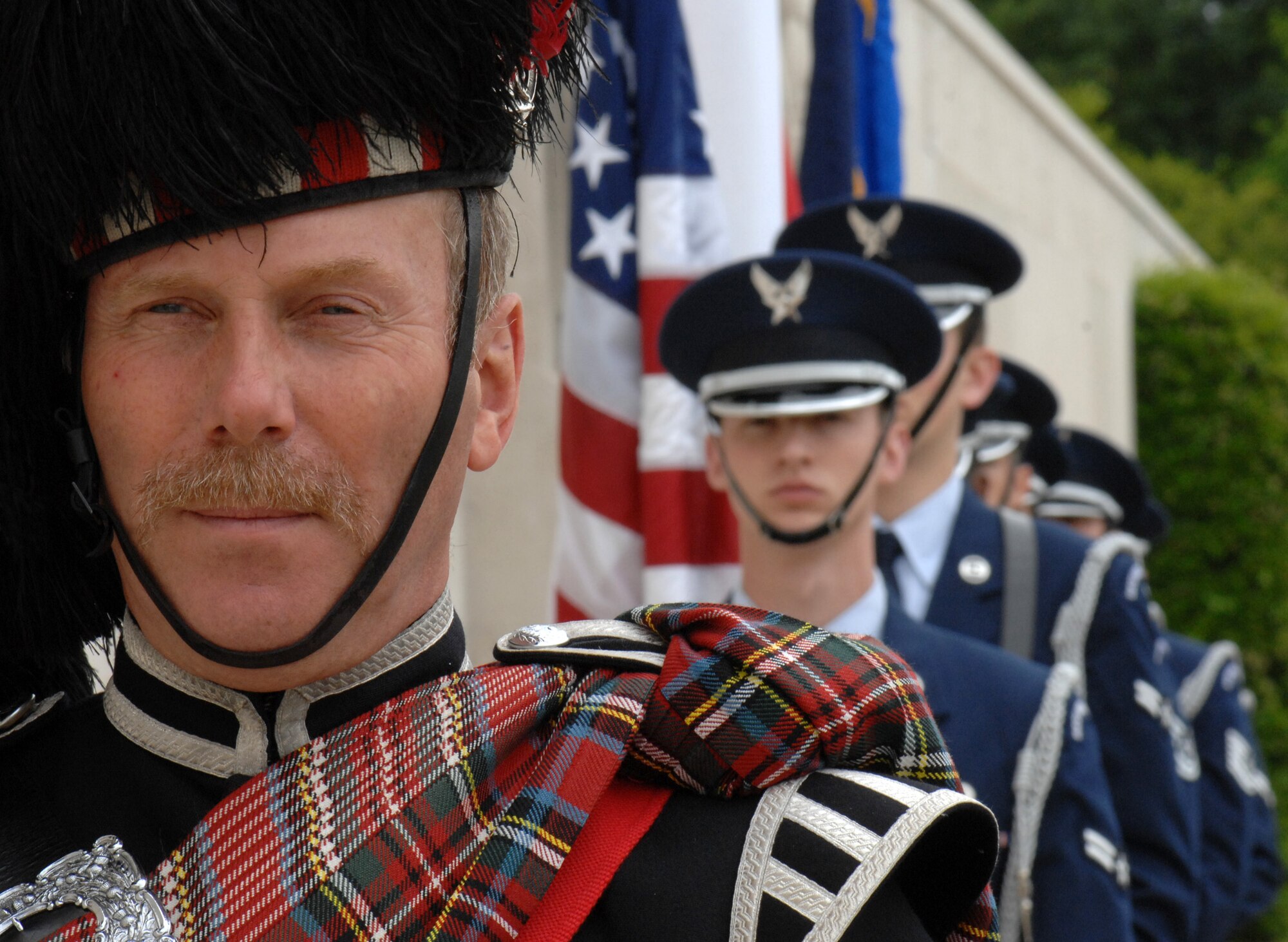 Dave Harper, the piper for the Memorial Day ceremony at Madingley Memorial Cemetery, prepares to march with the RAF Mildenhall Honor Guard Colors Team, May 25, 2009.  The colors team participated in a full-honors tribute to the veterans laid to rest on British soil.  (U.S. Air Force photo by Senior Airman Christopher L. Ingersoll)