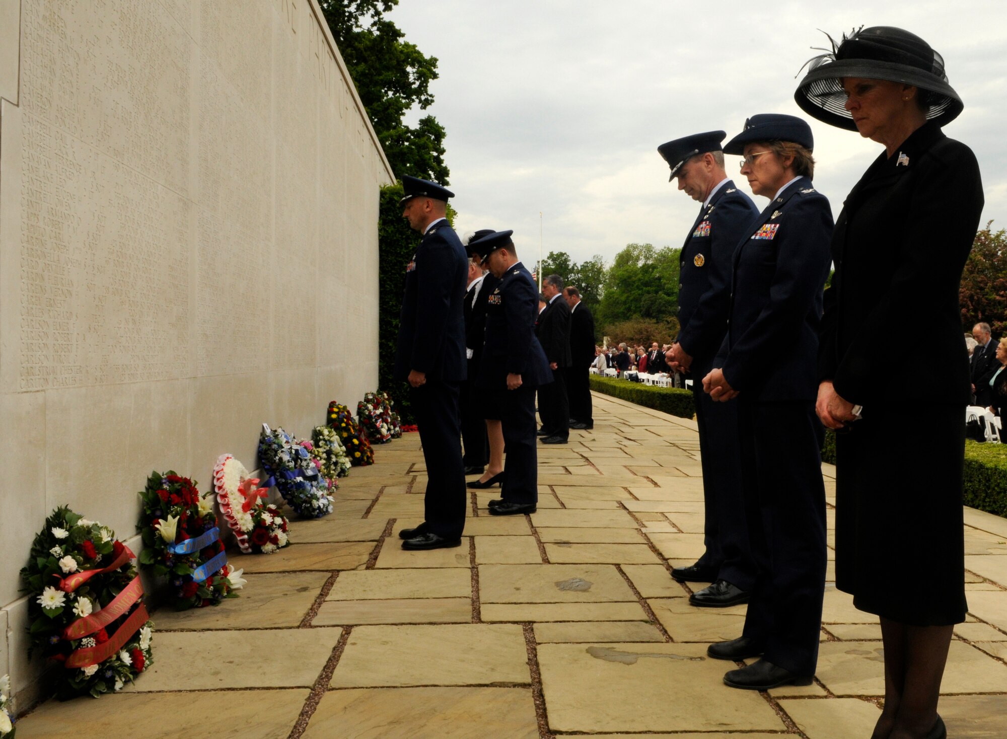 Jonna Doolittle Hoppes, granddaughter of Gen. James H. "Jimmy" Doolittle, Col. Edin J. Murrie, 100th Air Refueling Wing commander, and Maj. Gen. Mark R. Zamzow, 3rd Air Force vice commander lay wreaths at the Wall of the Missing at Madingley Memorial Cemetery on Memorial Day, May 25, 2009.  The cemetery is the final resting place for thousands of American veterans.  (U.S. Air Force photo by Senior Airman Christopher L. Ingersoll)