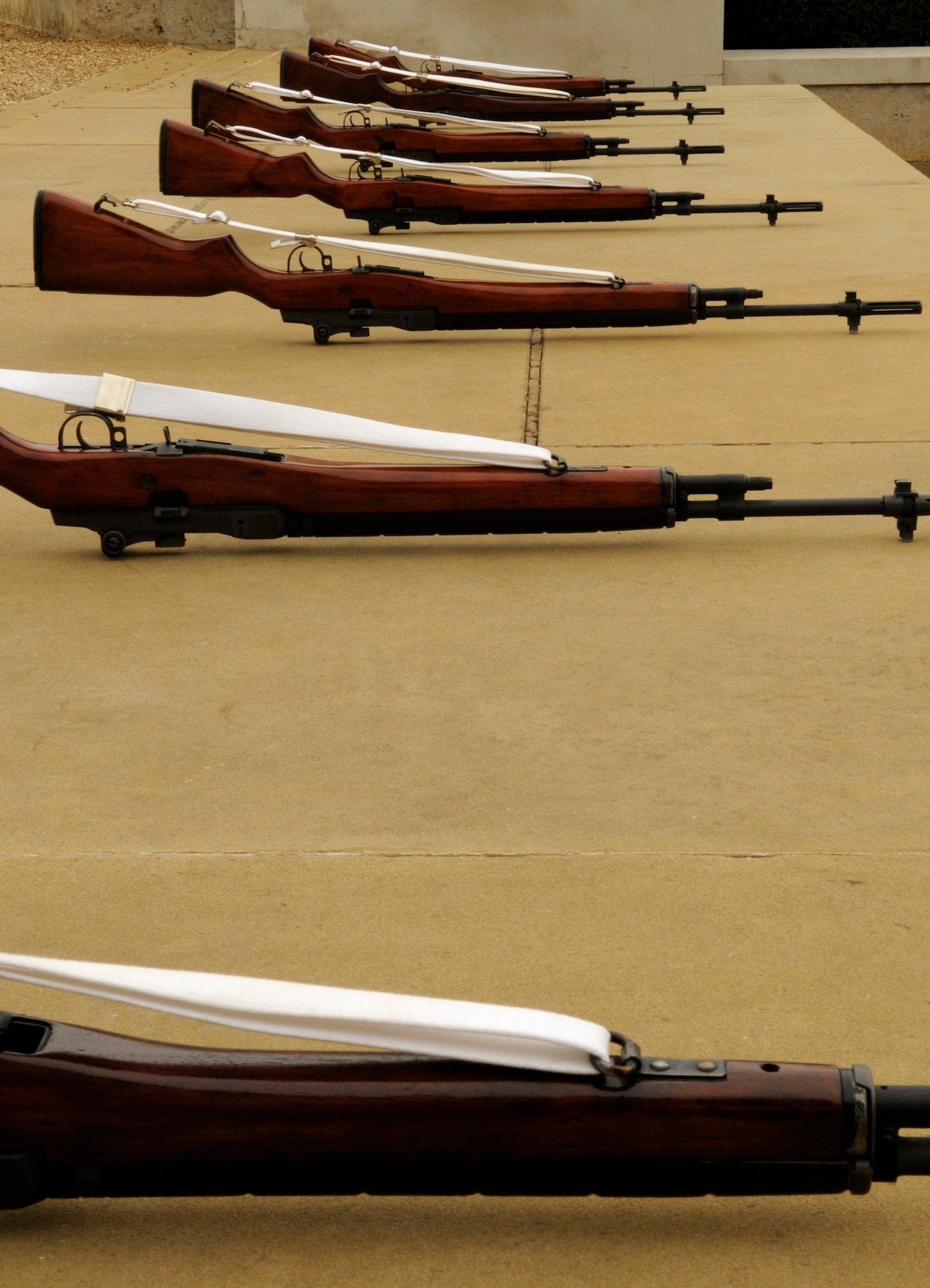 RAF MILDENHALL, England – Honor Guard rifles lay in line prepared for a 21-gun salute at Madingley Memorial Cemetery on Memorial Day, May 25, 2009.  The salute is to honor the thousands of U.S. war veterans laid to rest in England.  (U.S. Air Force file photo)