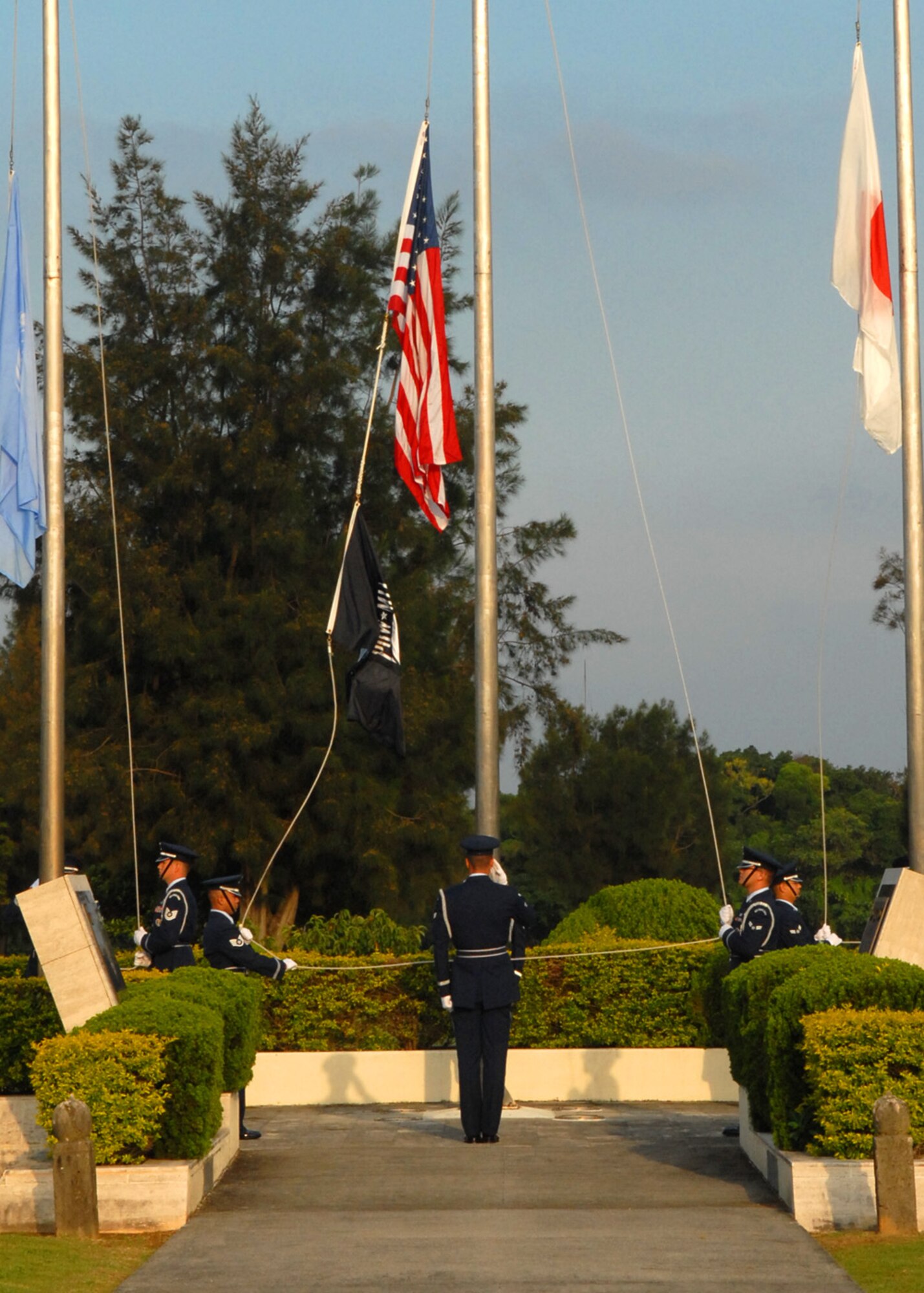Kadena Air Base Honor Guard members raise the United Nations, United States and Japanese flags during the 2009 Memorial Day Ceremony, May 25. Local military and civilians attended the event, honoring our heroes from the past. (U.S. Air Force photo/Staff Sgt. Christopher Hummel)
