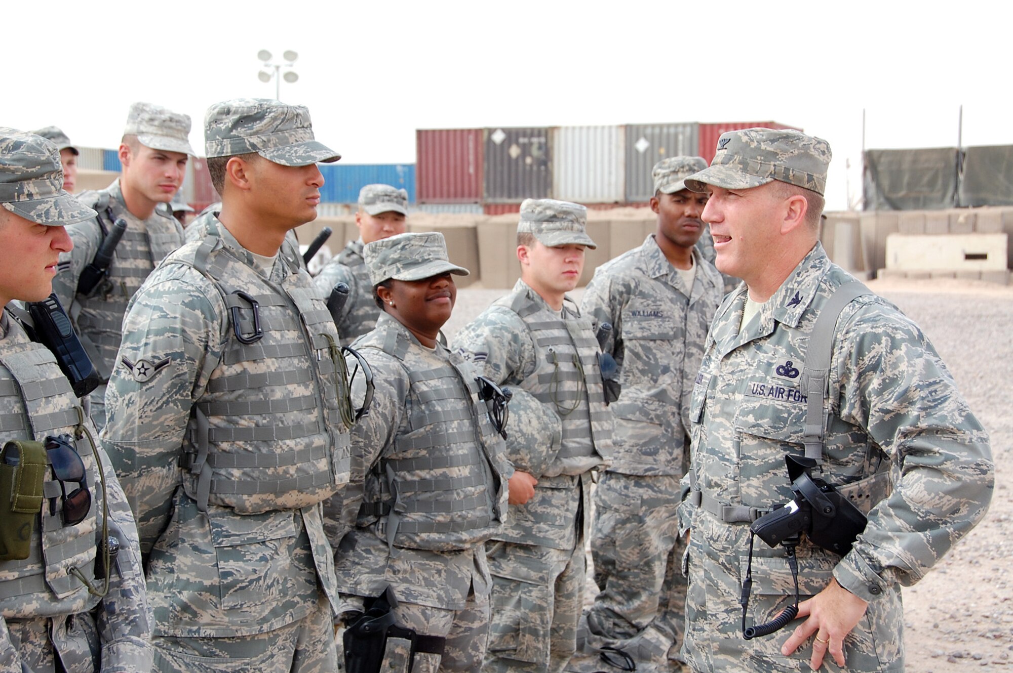 CAMP BUCCA, Iraq -- Col. Alan Metzler, 586th Air Expeditionary Group commander, addresses members of the 887th Expeditionary Security Forces Squadron during their morning guardmount at Camp Bucca, Iraq, May 12. Colonel Metzler commands one of three groups in the Air Force dedicated to Joint Expeditionary Taskings in the AOR. (U.S. Air Force photo by Staff Sgt. Thomas J. Doscher)