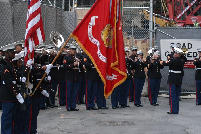 The 24th Marine Expeditionary Unit's color guard displays their colors as the Marine Forces Reserve Band plays for a ceremony at Ground Zero. The 24th MEU is the command element for Special Purpose Marine Air Ground Task Force New York. (Official Marine Corp photo by Lance Cpl. Jad Sleiman)