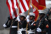 The 24th Marine Expeditionary Unit's color guard displays their colors as the Marine Forces Reserve Band plays for a ceremony at Ground Zero. The 24th MEU is the command element for Special Purpose Marine Air Ground Task Force New York. (Official Marine Corp photo by Lance Cpl. Jad Sleiman)
