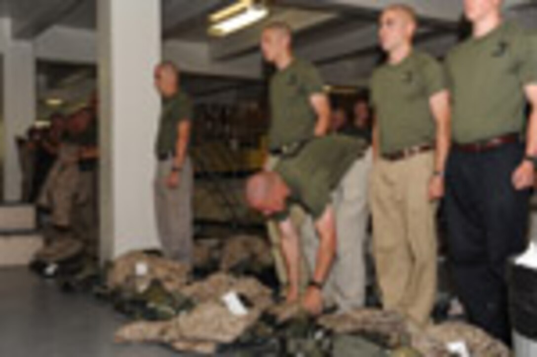 Candidates from Echo Company, Officer Candidate School, receive their uniform issue at the cash sales store aboard Marine Corps Base Quantico, Va., May 26, 2009.