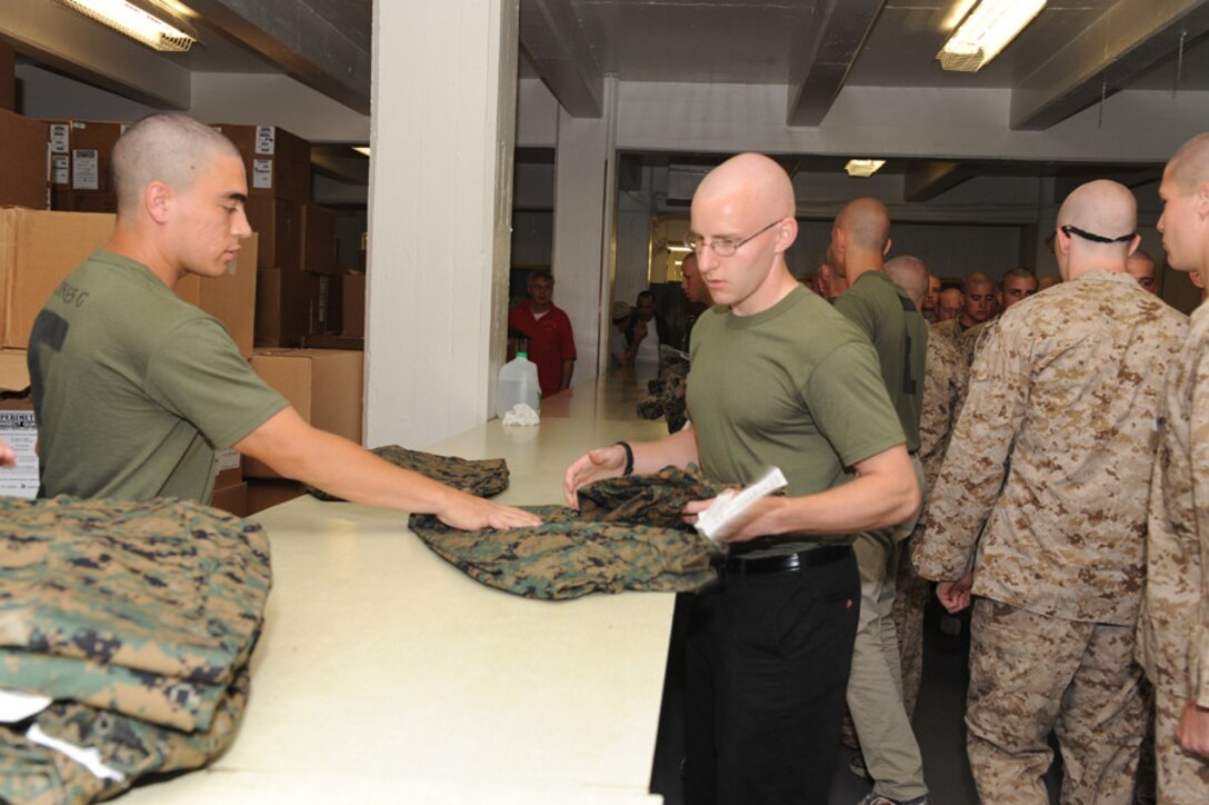 Candidates from Echo Company, Officer Candidate School, receive their uniform issue at the cash sales store aboard Marine Corps Base Quantico, Va., May 26, 2009.