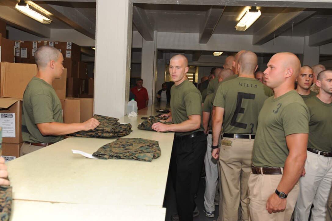 Candidates from Echo Company, Officer Candidate School, receive their uniform issue at the cash sales store aboard Marine Corps Base Quantico, Va., May 26, 2009.