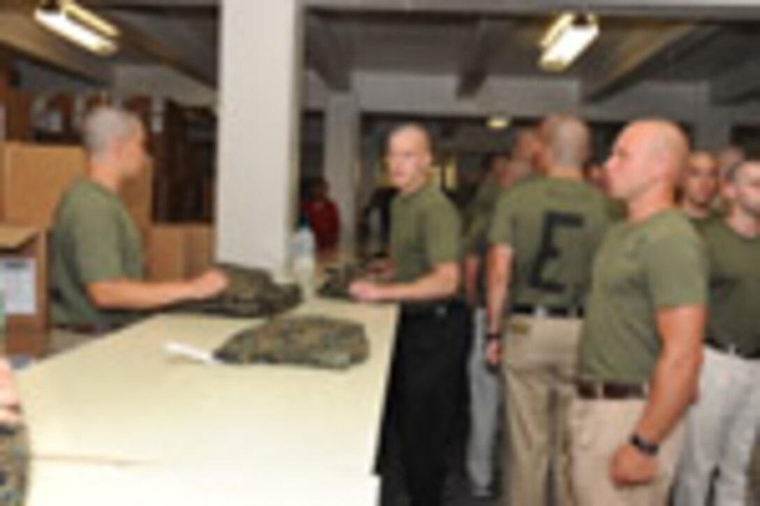 Candidates from Echo Company, Officer Candidate School, receive their uniform issue at the cash sales store aboard Marine Corps Base Quantico, Va., May 26, 2009.