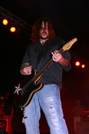 Lead singer Shaun Welgemoed rocks out during Seether's performance held at the parade deck here May 26. The grunge band Seether went on a weeklong United Service Organizations tour to show their appreciation for the armed services.