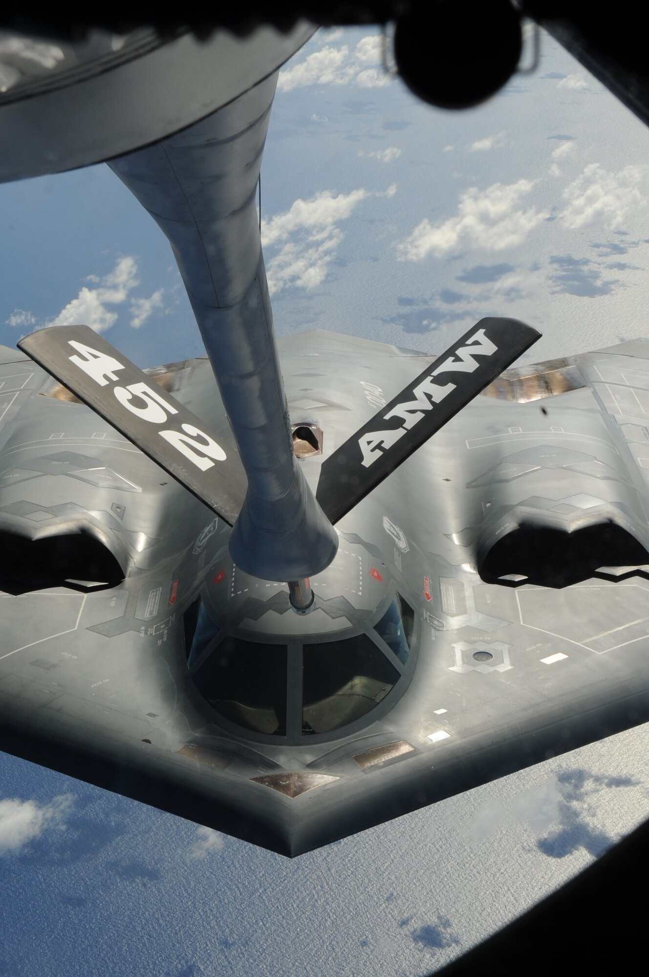 ANDERSEN AIR FORCE BASE, Guam-- A B-2 Spirit is refueled by a KC-135 Stratotanker over the Pacific Ocean. The 13th Expeditionary Bomb Squadron and 506th Expeditionary Air Refueling Squadron are currently deployed here in support of the Continuous Bomber Presence. (U.S. Air Force photo)