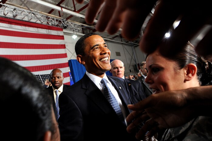 President Barack Obama greets Nellis Airmen and civilian attendees after his speech about the America Reinvestment and Recovery Act of 2009 at the Thunderbird Hanger, Nellis Air Force Base, Nev., May 27. The Recovery Act was endorsed Feb. 16, and included such provisions as boosting our nation’s economy by creating jobs, improving our nation’s infrastructure and promote renewable energy resources. (U.S. Air Force photo by Lawrence Crespo)