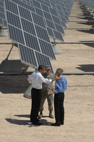 President Barack Obama, Col. Dave Belote, 99th Air Base Wing commander, and Sen. Harry Reid, D-Nev., tour the Nellis Air Force Base, Nev., photovoltaic array here, May 27.  As the largest solar energy field in the Western Hemisphere, the PVA has over 72,000 solar panels which save the base approximately $1 million a year in energy costs. (U.S. Air Force photo by Senior Airman Nadine Y. Barclay). 