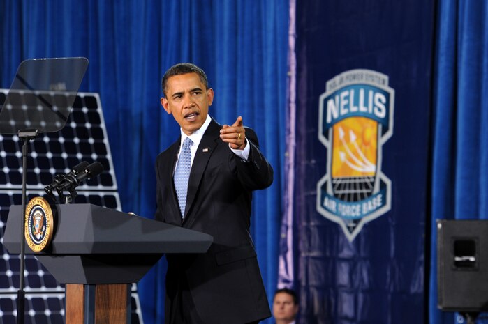President Barack Obama announced two added energy provisions to the American Recovery and Reinvestment Act of 2009 to more than 400 military and civilian members at the Thunderbird Hanger at Nellis Air Force Base, Nev., May 25. Prior to his speech, President Obama visited Nellis' photovoltaic array, the largest solar energy farm in the western hemisphere. The PVA has more than 72,000 solar panels, which save the base about $1 million a year in energy costs. (U.S. Air Force photo by Lawrence Crespo)
