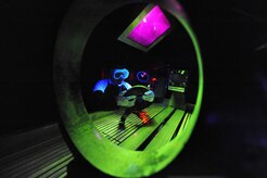 Senior Airman Lilia Linares utilizes a fluorescent magnetic particle process to inspect an aerospace ground equipment hook for cracks at Charleston Air Force Base, S.C., May 27, 2009. The non-destructive inspection section inspects more than 40,000 pieces of weapon systems and non-weapon systems assets a year. Airman Linares is a non-destructive inspection journeyman with the 437th Maintenance Squadron. (U.S. Air Force photo/James M. Bowman)