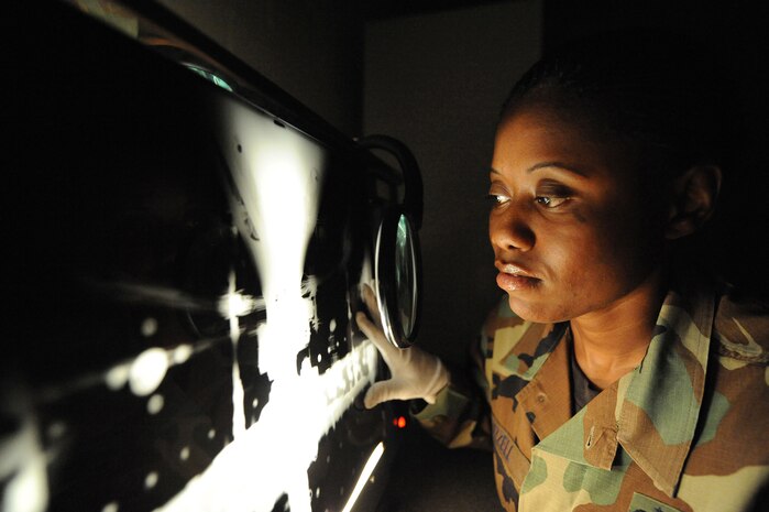 U.S. Air Force Tech. Sgt. Tamekia Bizzell inspects a radiography taken of a horizontal stabilizer from a C-17 for foreign objects at Charleston Air Force Base, S.C., May 27, 2009. The non-destructive inspections section is responsible for ensuring structural integrity on both weapons and non-weapons system assets. Sergeant Bizzell is a non-destructive craftsman with the 437th Maintenance Squadron. (U.S. Air Force photo by James M. Bowman)(Released)

