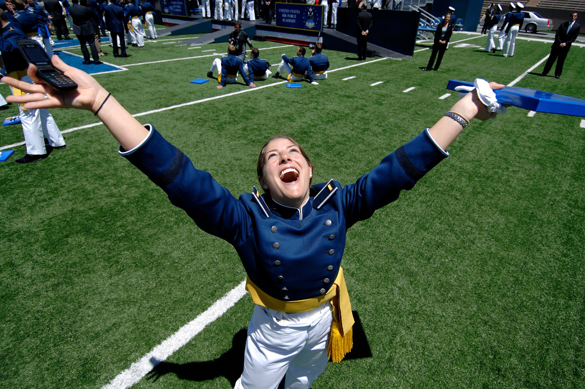 Newly commissioned 2nd Lt. Ashleigh Peck celebrates following graduation from the U.S. Air Force Academy May 27 at Falcon Stadium.  She is slated to become an Air Force public affairs officer.  (U.S. Air Force photo/Dennis Rogers)