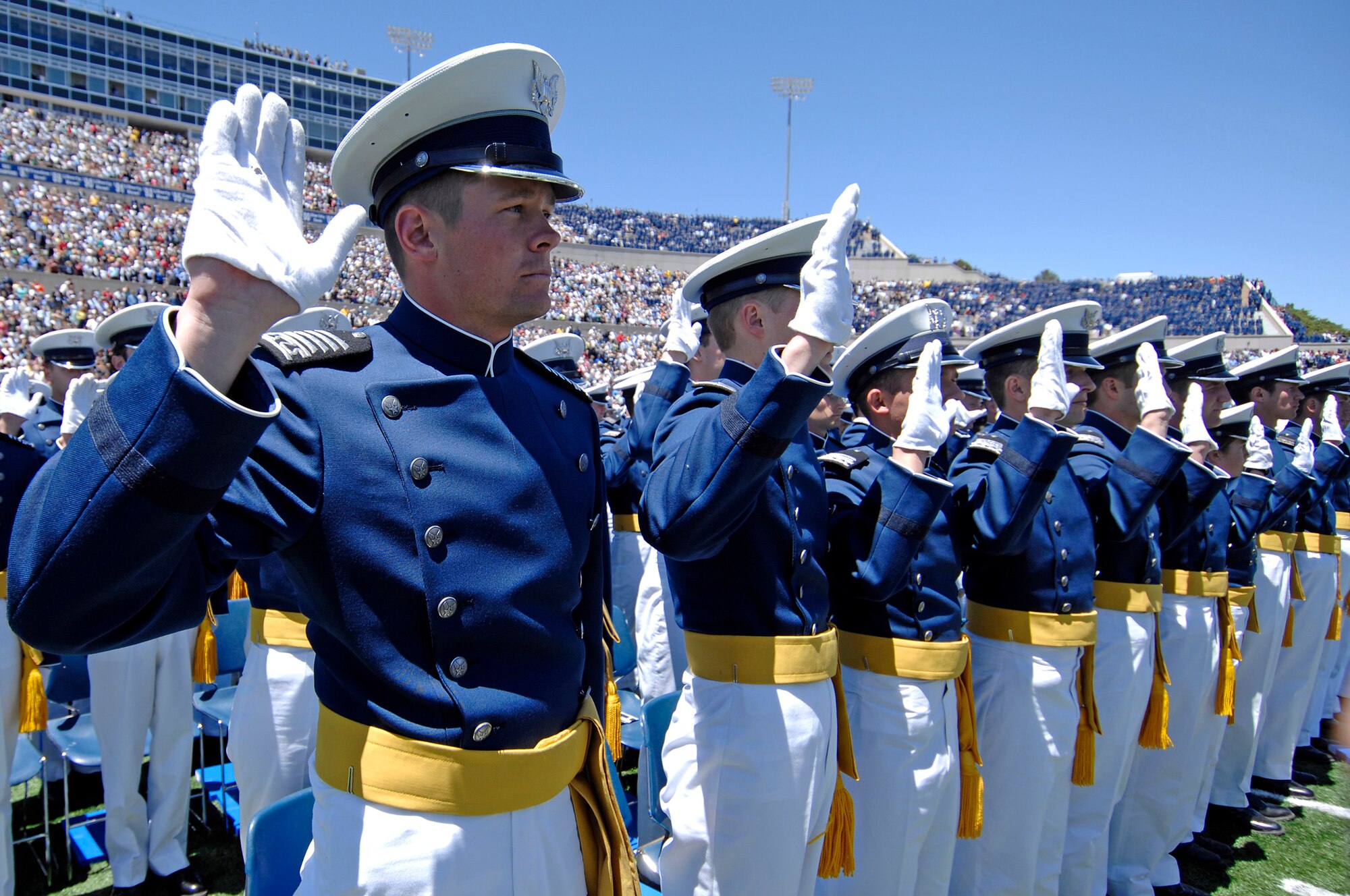 Cadet Bradley Dewees recites the oath of office along with his fellow U.S. Air Force Academy cadets on his way to becoming a second lieutenant during the graduation ceremony May 27 in Falcon Stadium. Lieutenant Dewees was the top graduate in the Class of 2009.     (U.S. Air Force photo/Dennis Rogers)