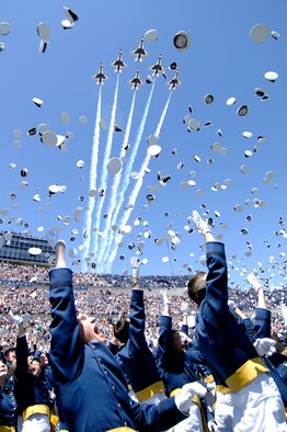 The 1,046 newly commissioned second lieutenants at the U.S. Air Force Academy commemorate their achievement by tossing their hats as the Air Force Thunderbirds fly over Falcon Stadium May 27.  (U.S. Air Force photo/Dennis Rogers)