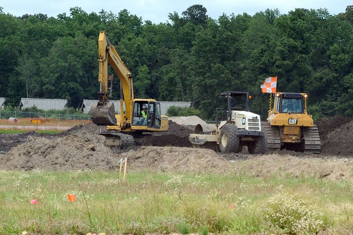 Contractors work to rebuild Runway 03/21 at Charleston AFB May 26. The runway construction is part of a $30 million project to completely replace the deteriorating runway. The runway is being rebuilt using anywhere between 18 to 24 inches of concrete rather than asphalt to allow for a longer life span. The last major repair done on runway 03/21 was in 1968. (U.S. Air Force photo by Staff Sgt. Marie Cassetty)