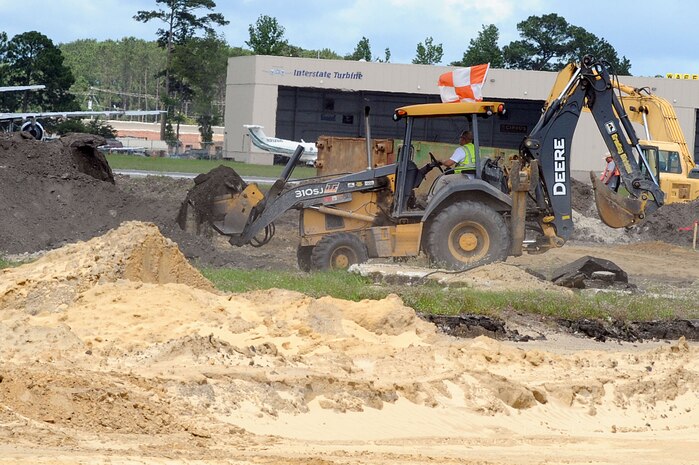 Contractors work to rebuild Runway 03/21 at Charleston AFB May 26. The runway construction is part of a $30 million project that will allow larger aircraft the capability of landing at the base. The last major repair done on runway 03/21 was in 1968. (U.S. Air Force photo by Staff Sgt. Marie Cassetty)