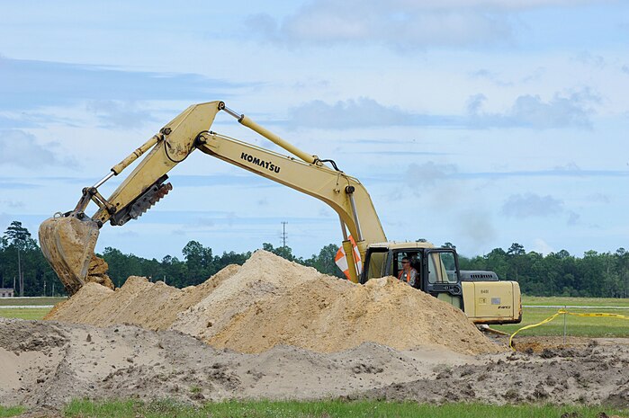 Contractors work to rebuild Runway 03/21 at Charleston AFB May 26. The runway construction is part of a $30 million project, which will allow larger aircraft the capability of landing at the base. The runway is being rebuilt using anywhere between 18 to 24 inches of concrete rather than asphalt to allow for a longer life span. The last major repair done on runway 03/21 was in 1968. (U.S. Air Force photo by Staff Sgt. Marie Cassetty)