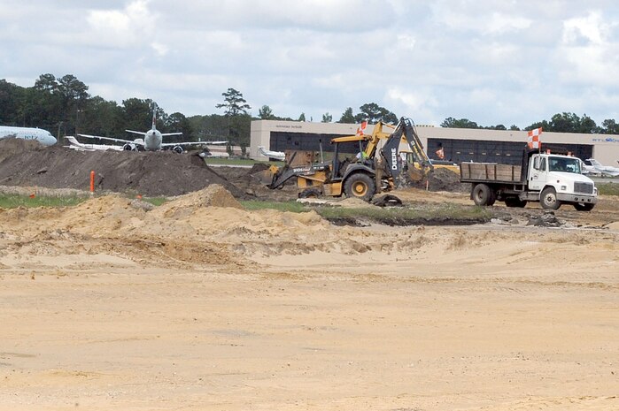 Contractors work to rebuild Runway 03/21 at Charleston AFB May 26. The runway construction is part of a $30 million project in order to allow larger aircraft the capability of landing at the base. The last major repair done on runway 03/21 was in 1968. (U.S. Air Force photo by Staff Sgt. Marie Cassetty)