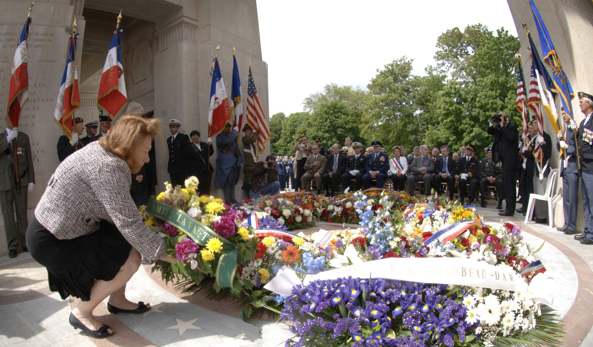 Mrs. Christiane Barody-Weiss, mayor of Marnes-la-Croquette and Lt. Gen. Gilles Desclaux, commander-in-chief, French Air Defense and Air Operations lead U.S. Air Forces in Europe commander, Gen. Roger A. Brady, Mr. Mark A. Pekala, charge of affairs of the United States of America in France and other distinguished visitors in a tour of the Lafayette Escadrille Memorial's underground crypt of 68 caskets. (U.S. Air Force photo/Master Sgt. Scott Wagers)