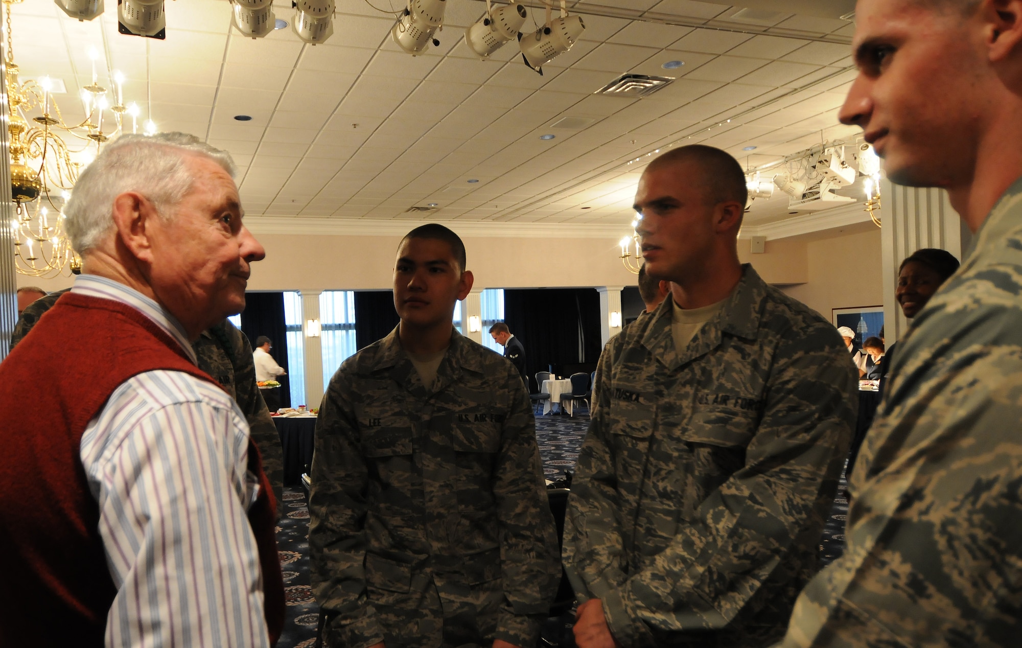 The fifth Chief Master Sergeant of the Air Force Robert D. Gaylor interacts with Air  Force Honor Guard trainees after a CMSAF room dedication ceremony in the Bolling Club May 26th Bolling AFB . The room was dedicated to honor our highest enlisted position and provided an opportunity for the newest generation of Airmen to interact with previous generations.  (U.S Air Force photo by Senior Airman Alex Montes)