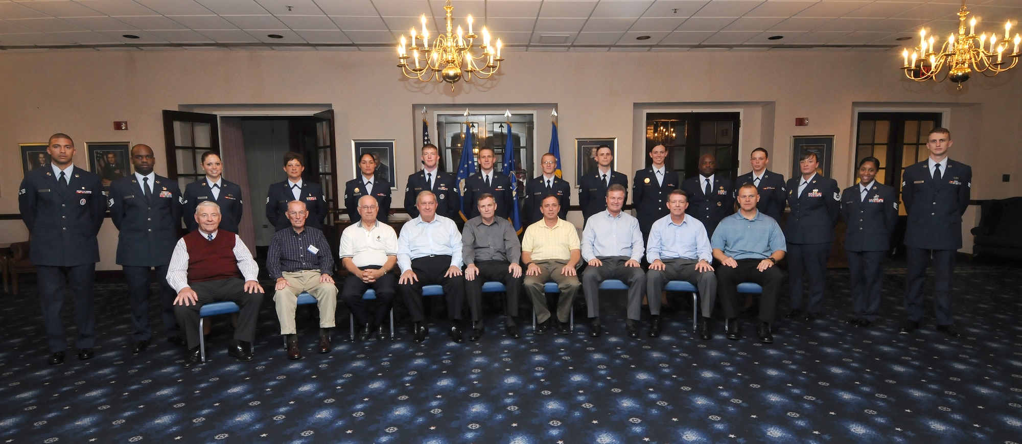 Airmen from the 11th Wing stand behind eight chief master sergeants of the Air Force and the chief master sergeant who was recently selected to replace Chief Master Sgt. of the Air Force Rodney J. McKinley during a  CMSAF room dedication ceremony  in the Bolling Club May 26th Bolling AFB. The room was dedicated to honor our highest enlisted position and provided an opportunity for the newest generation of Airmen to interact with previous generations.  (U.S Air Force photo by Senior Airman Alex Montes)
