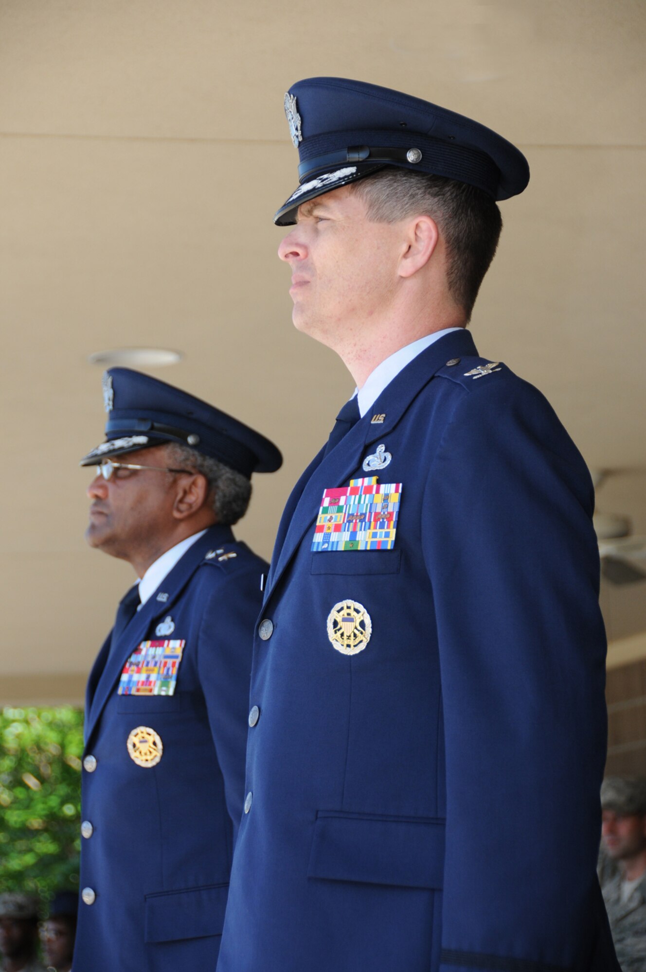 General Flowers and Colonel Dickinson prepares to pass the 81st Training Wing guidon during Tuesday’s ceremony on the parade field.  (U.S. Air Force photo by Kemberly Groue)