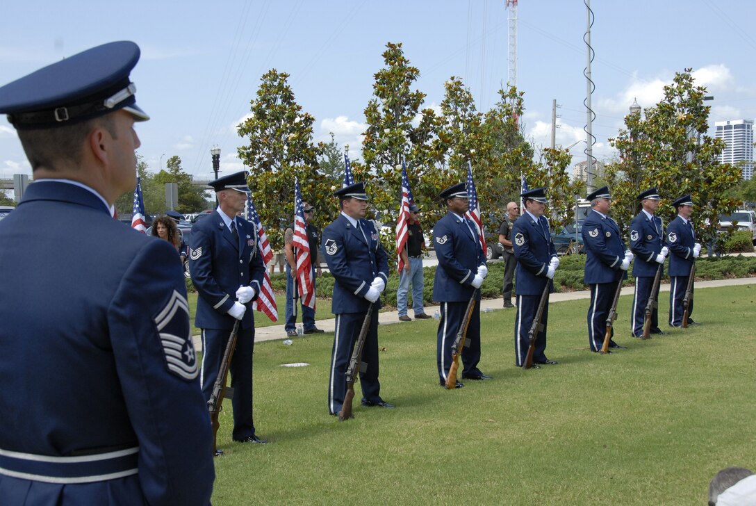 Members of the 125th Fighter Wing Color Guard Firing Detail stands at parade rest at the City of Jacksonville's Memorial Day Tribute to fallen heroes at the Veteran's Memorial Wall in downtown Jacksonville, Fla. May 25, 2009.(Air National Guard Photo by Staff Sgt. Jaclyn Carver)