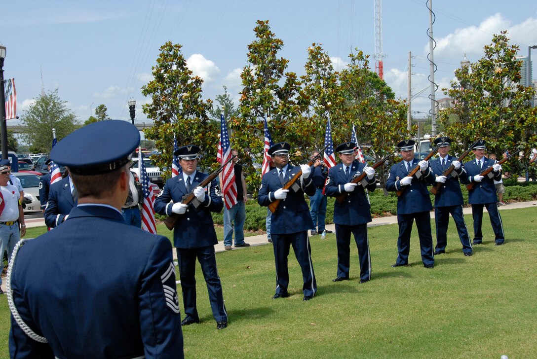 The 125th Fighter Wing Color Guard Firing Detail  performs a twenty-one gun salute at the City of Jacksonville's Memorial Day Tribute to fallen heroes at the Veteran's Memorial Wall in downtown Jacksonville, Fla. May 25, 2009.(Air National Guard Photo by Staff Sgt. Jaclyn Carver)
