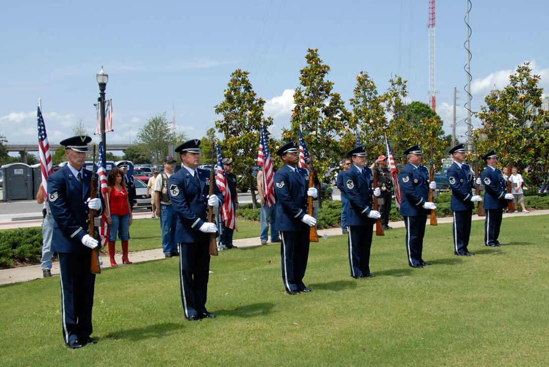 The 125th Fighter Wing Color Guard Firing Party performs a twenty-one gun salute at the City of Jacksonville's Memorial Day Tribute to fallen heroes at the Veteran's Memorial Wall in downtown Jacksonville, Fla. May 25, 2009. (Air National Guard Photo by Staff Sgt. Jaclyn Carver)
