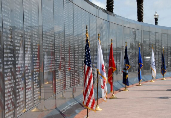 The Untied States and Military Services flags line the Veteran's Memorial Wall at the City of Jacksonville's Memorial Day Tribute to fallen heroes at the Veteran's Memorial Wall in downtown Jacksonville, Fla. May 25, 2009.(Air National Guard Photo by Staff Sgt. Jaclyn Carver)
