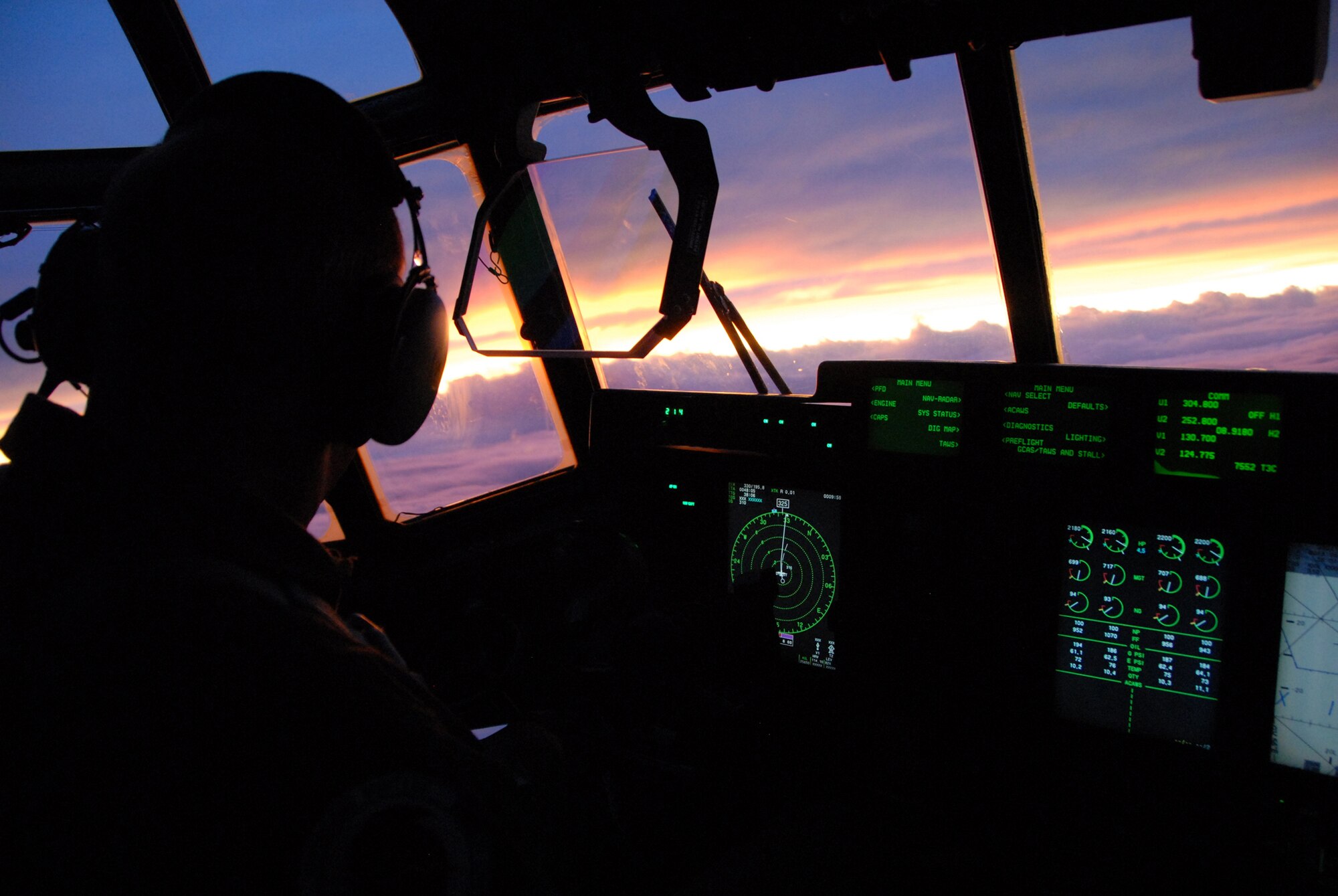 Lt. Col. Mark Carter admires the sunset after nine hours of flying into a hurricane.  The Hurricane Hunters from Keesler fly 24 hours a day, collecting data inside the heart of Mother Nature’s fury.  The data collected by the Hurricane Hunters improve the National Hurricane Center’s forecast by 30 percent.  (403rd Wing photo)
