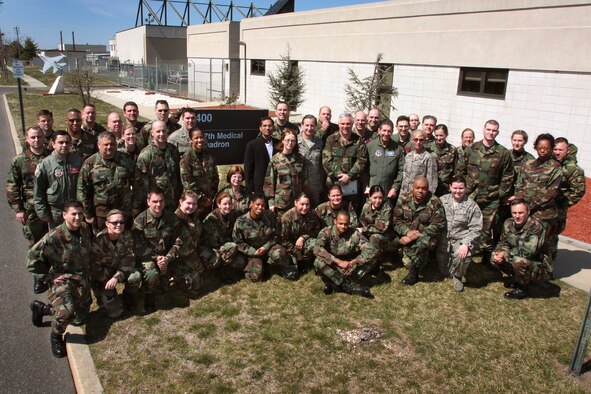 A picture of Airmen of the 177th Medical Group posing for a group photo outside the 177th Fighter Wing Medical Clinic.