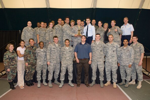 HANSCOM AIR FORCE BASE, Mass. – Lt. Gen. Ted Bowlds, Electronic Systems Center commander, presented members of the 66th Air Base Wing Olympic Team with the first place Hanscom Olympic trophy on May 21, during closing ceremonies for the games. (U.S. Air Force photo by Rick Berry)