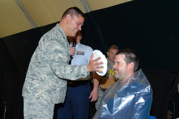 HANSCOM AIR FORCE BASE, Mass. – Paul Shoesmith of the 66th Services Squadron prepares to take a pie in the face during the Installation picnic on May 21 at the conclusion of Hanscom’s Olympic competition at the Tennis Bubble. (U.S. Air Force photo by Rick Berry) 