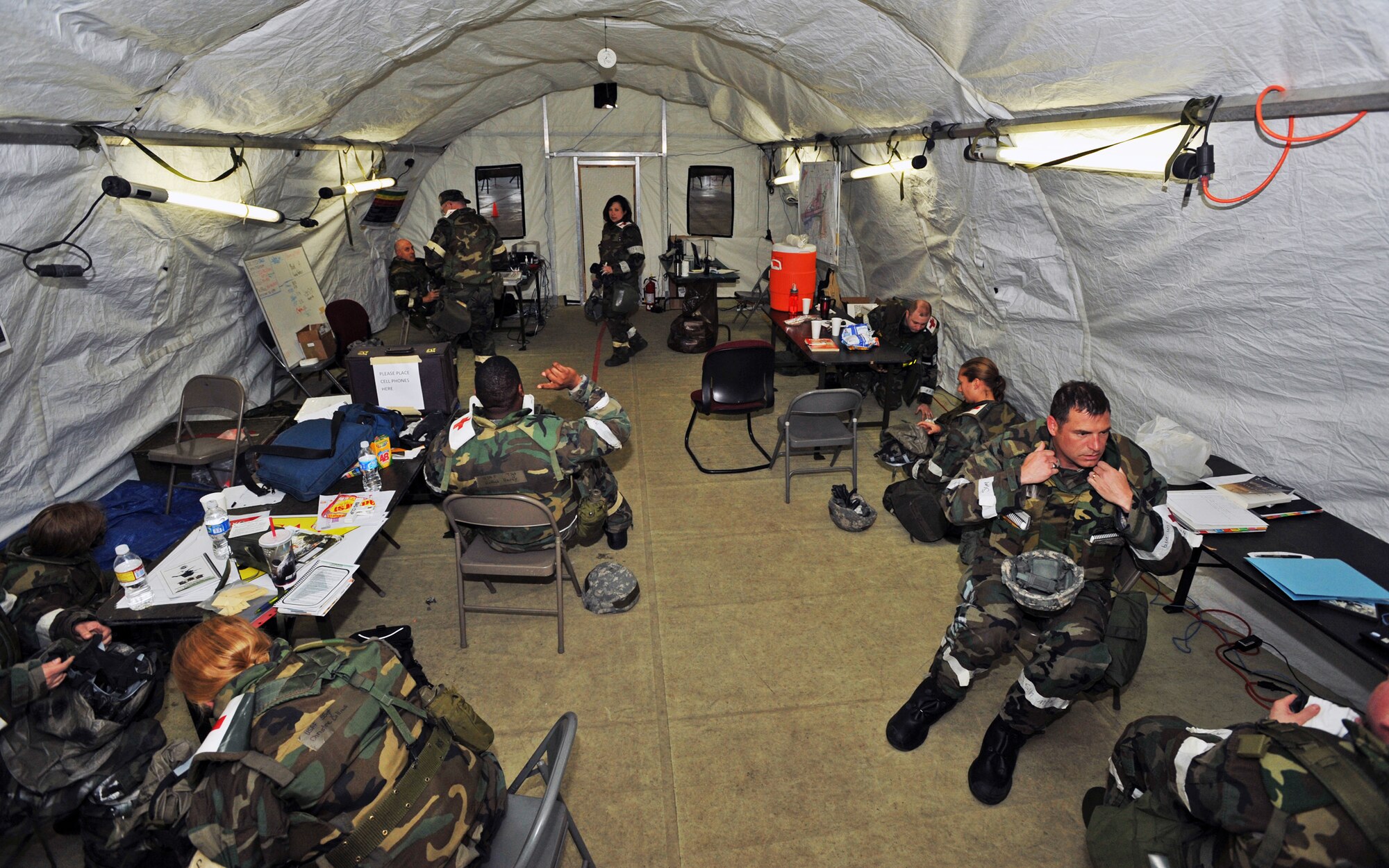 ELMENDORF AIR FORCE BASE, Alaska -- Medical staff from the 3rd Medical Group remove their Mission Oriented Protective Posture gear after donning MOPP 4 during Polar Force 09-05 May 20, 2009. The exercise helped to prepare base members for the upcoming Operational Readiness Inspection beginning June 1. (U.S. Air Force/Senior Airman Laura Turner)