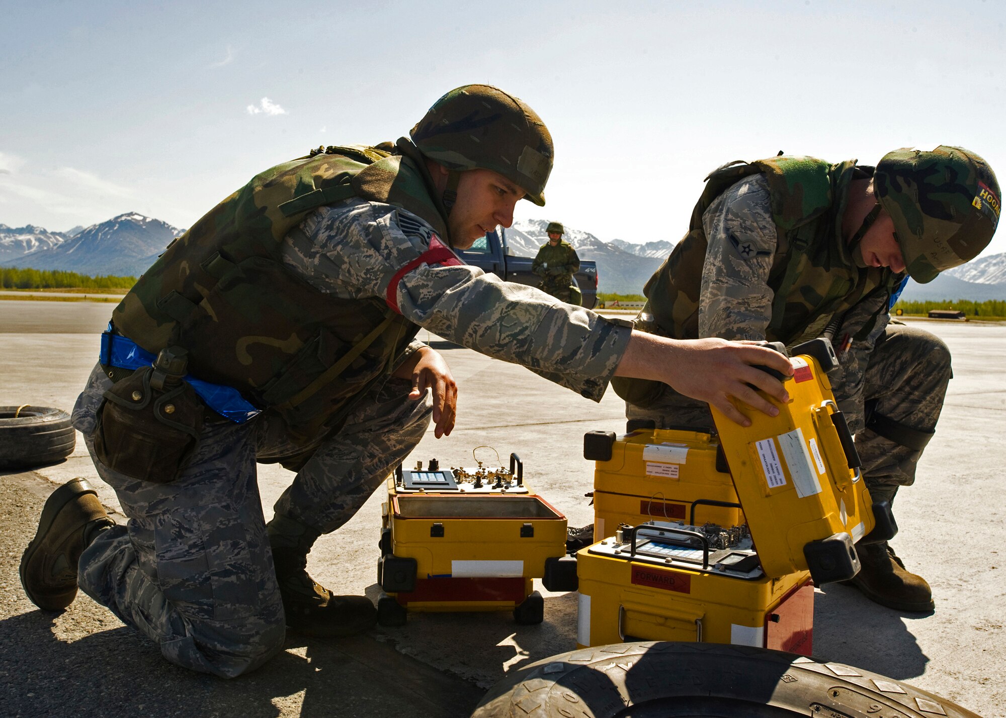ELMENDORF AIR FORCE BASE, Alaska -- Staff Sgt. Carmine Reese and Airman Francis Nolan, 19th Aircraft Maintenance Unit, set up radio frequency testers during Polar Force 09-05 May 19, 2009. The exercise helped to prepare base members for the upcoming Operational Readiness Inspection beginning June 1. (U.S. Air Force/Senior Airman Laura Turner)