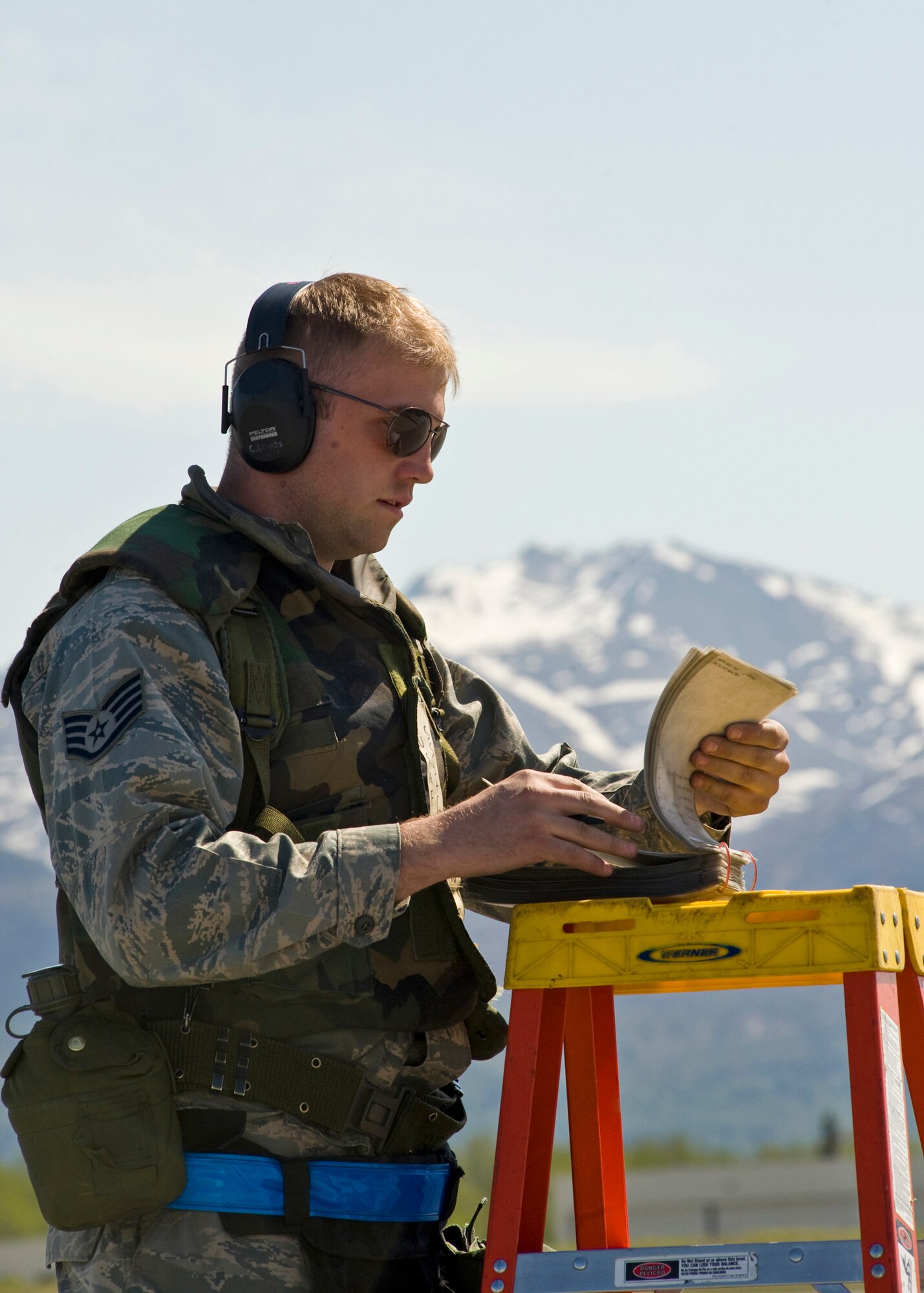 ELMENDORF AIR FORCE BASE, Alaska -- Staff Sgt. Christopher Grantz, 19th Aircraft Maintenance Unit, reviews the checklist for loading operations during Polar Force 09-05 May 19, 2009. The exercise helped to prepare base members for the upcoming Operational Readiness Inspection beginning June 1. (U.S. Air Force/Senior Airman Laura Turner)