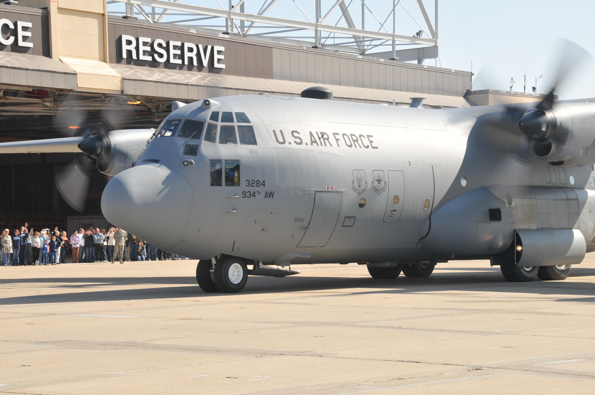 Family and friends wave goodbye as a 934th Airlift Wing C-130 taxis out carrying the Reservists to their deployment in Southwest Asia. More than 150 from operations and maintenance deployed in May.
Force Photo/Tech. Sgt. Bob Sommer)