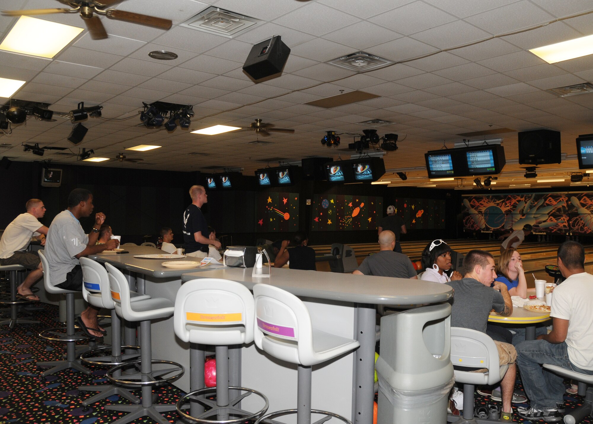 ALTUS AIR FORCE BASE, Okla.—Airmen gather at the Galaxy Lanes Bowling Center May 26 for Single Airmen Bowling Night. The center provides pizza, fountain drinks and bowling free of charge for single Airmen, E-1 through E-4, once a month from 6:00 p.m. to 8:00 p.m. The next SABN will be July 28. (U.S. Air Force photo/Airman 1st Class Tiffany M. Deuel)