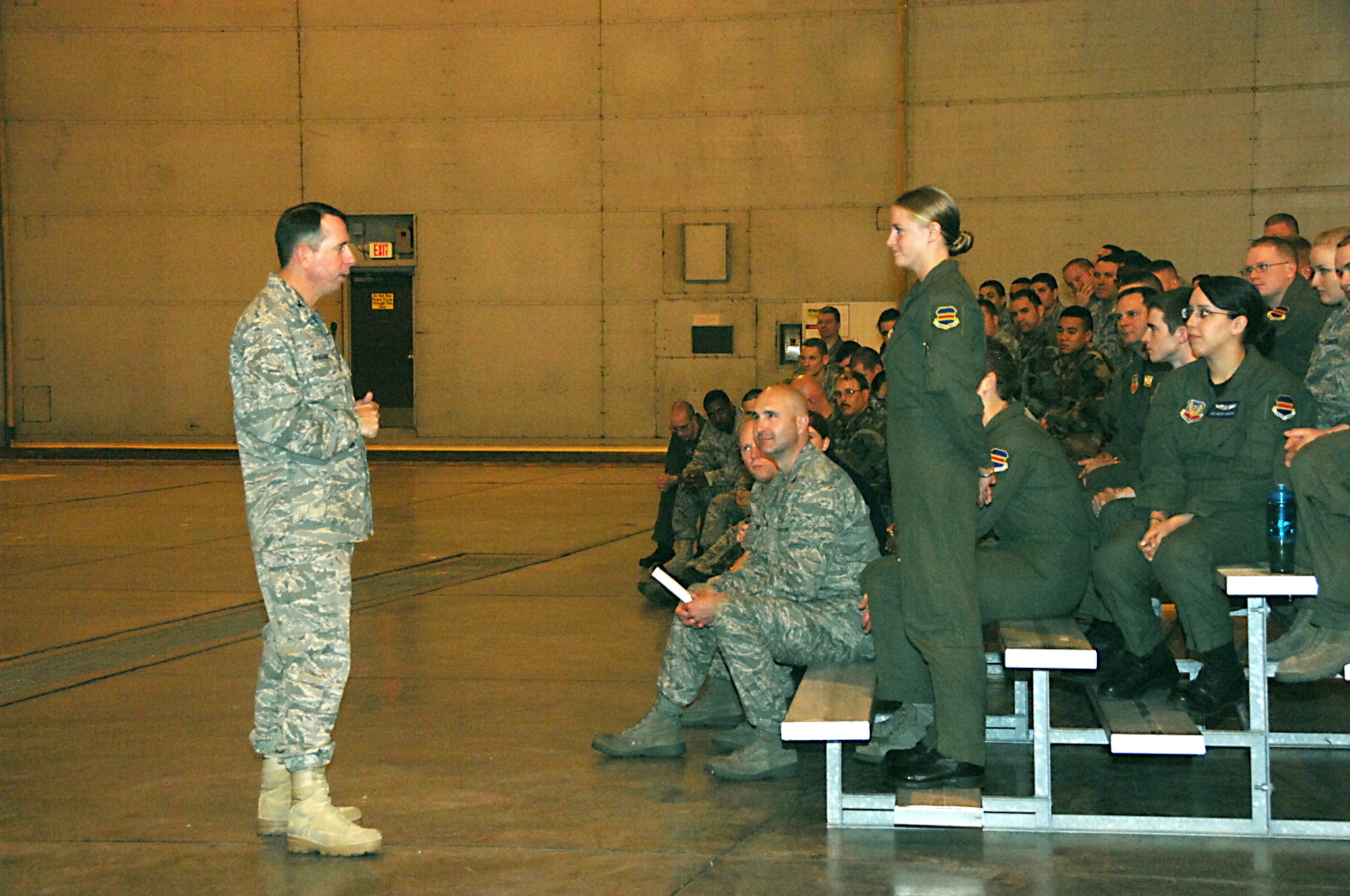 OFFUTT AIR FORCE BASE, Neb.-- Col. John N.T. Shanahan, 55th Wing commander, listens to Senior Airman Cole A. Hamm, 97th Intelligence Squadron, explain what Operational Risk Management is during Commander's Call at the Bennie Davis Maintenance Facility here May 21. Commander's Call kicked off the Wing's annual Safety Day, which focuses on reminding Airmen to practice safety on a daily basis. U.S. Air Force photo by Kendra Williams