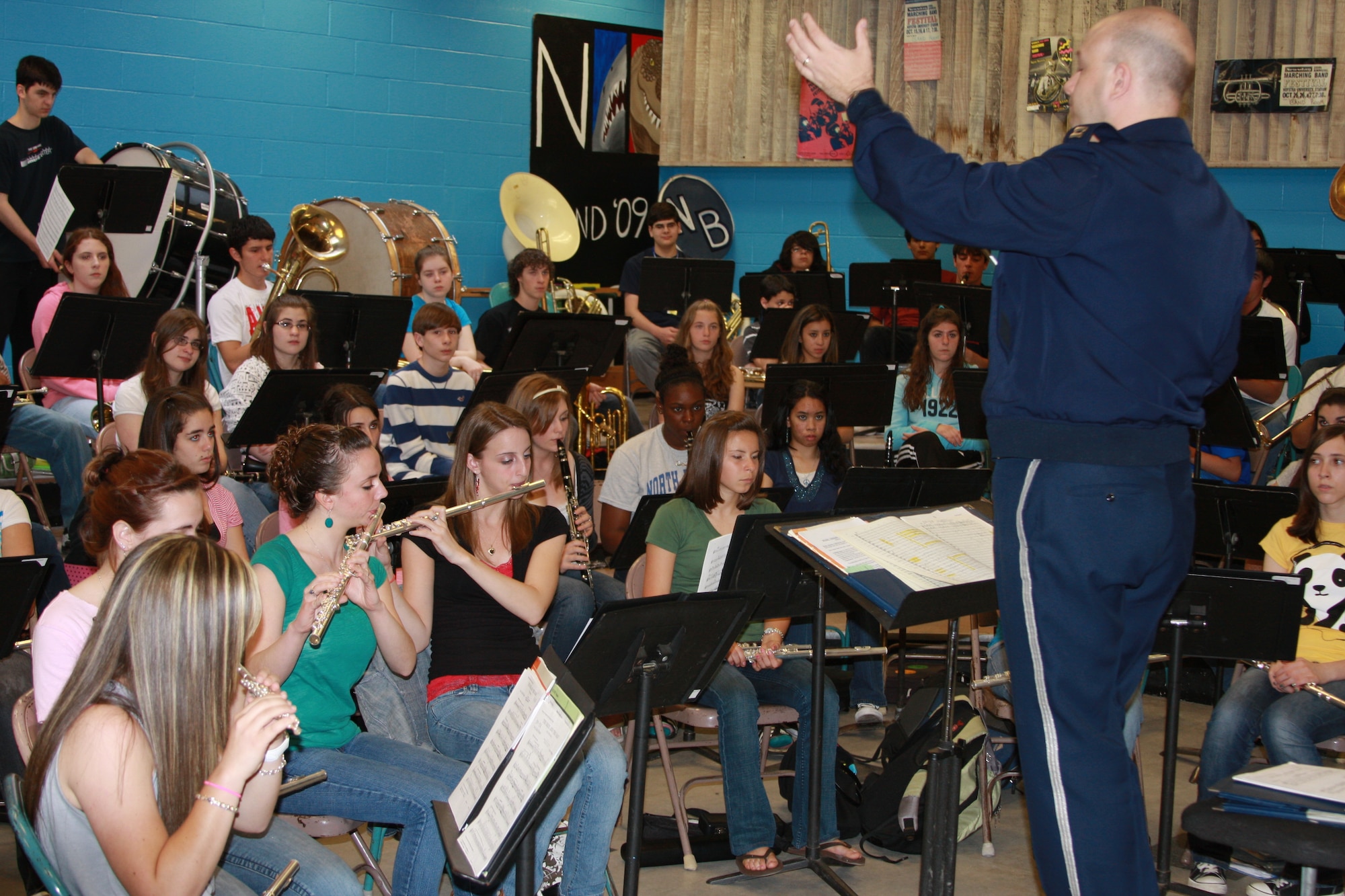 Capt. Alpar welcomed the opportunity to "fine tune" a few things in a musical selection the high school band had been working on. 