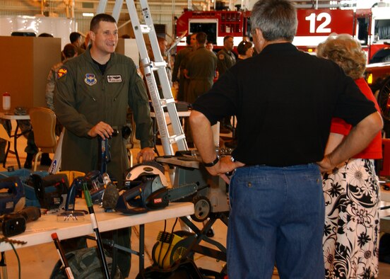 Maj. David Aumack from the Safety Office presents tips on power-tool home safety during Vance’s Safety Day Expo. He is demonstrating the proper use of a right-angle drill and other tools, explaining how to avoid injuries at home. The Safety Day Expo took the place of a traditional safety briefing and was open 9 a.m. to 11 a.m, May 22, in Hangar 170 to kick-off the 101 Critical Days of Summer. (U.S. Air Force Photo/Staff Sgt. Brian Hill)