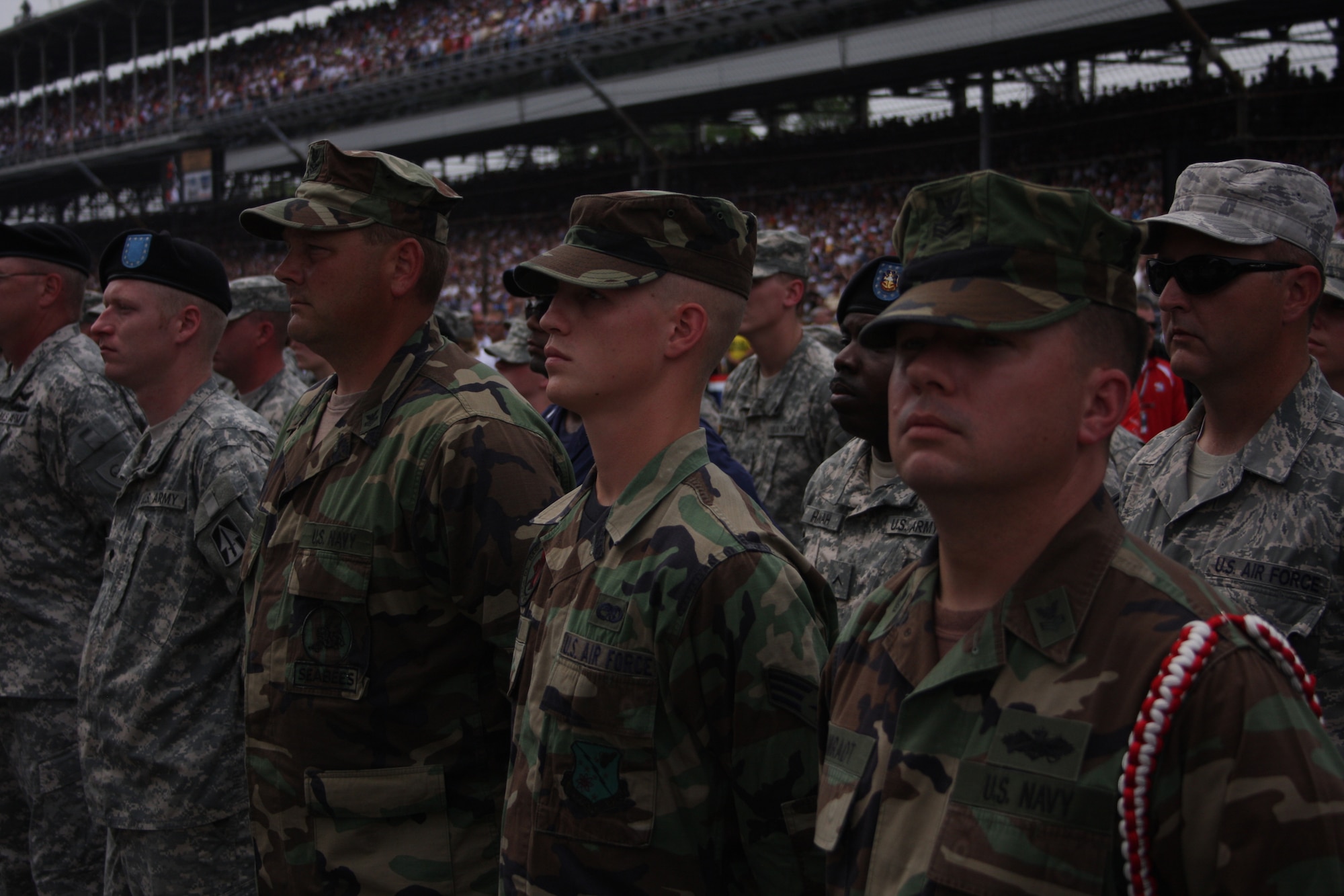 WRIGHT-PATTERSON AIR FORCE BASE, Ohio – More than 30 Team Wright-Patt Airmen had the opportunity to participate in several pre-race activities at the start of the 93rd Indianapolis 500 May 24.  Military members from all branches of service participated in a group formation, flag display and some held flags and stars along the main stretch of the track.  (Air Force photo/Staff Sgt. Ken LaRock)