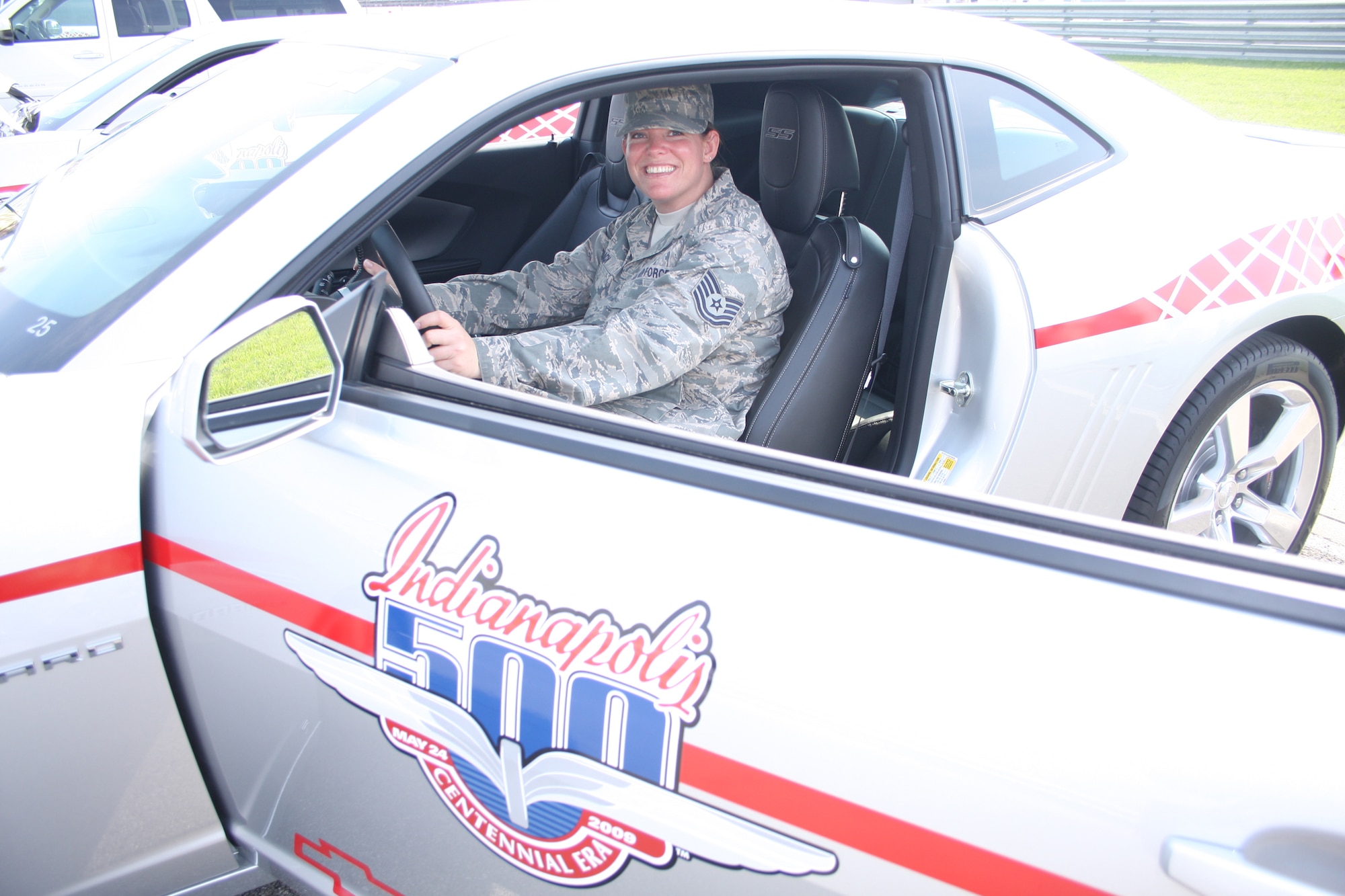 WRIGHT-PATTERSON AIR FORCE BASE, Ohio – Tech. Sgt. Anna Tracy, 445th Logistics Readiness Squadron, sits in one of the pace cars driven in the 93rd  Indianapolis 500 May 24.  Sergeant Tracy along with more than 1,200 active duty, Guard and Reserve members and their guests from all branches of the Armed Forces took part in the pre-race activities before the start of the race. (Air Force photo/Staff Sgt. Ken LaRock)