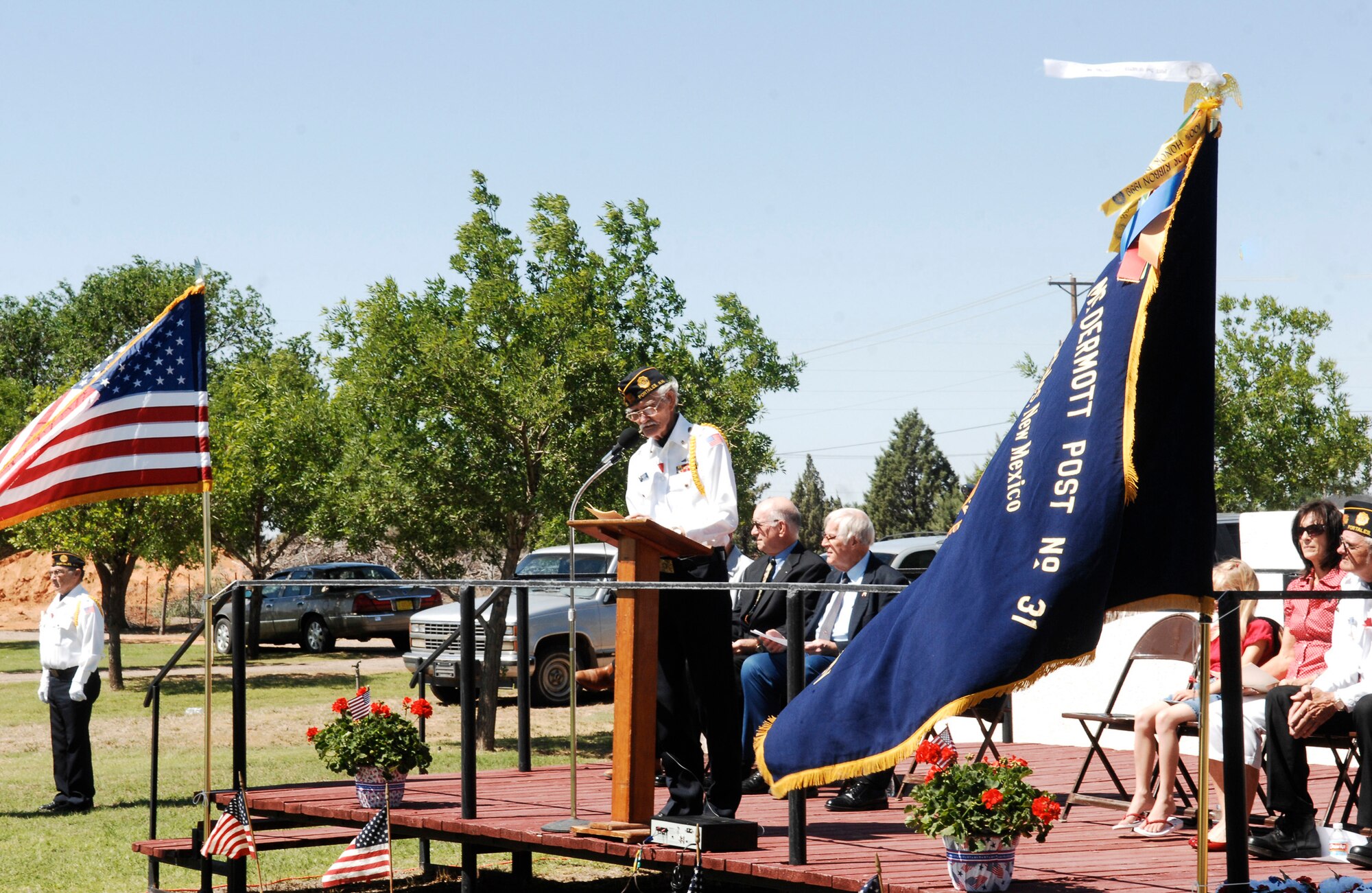 CANNON AIR FORCE BASE, N.M. -- Joe Blair, commander of the American Legion Post 31, welcomes all to the 64th annual Portales American Legion observance May 25. The memorial service was held at the Portales Cemetery where they honored veterans as well as gave a tribute to two Gold Star Mothers. Gold Star Mothers is an organization of mothers who have lost a son or daughter in the service of our country. (U.S. Air Force photo by Airman 1st Class Danielle Powell)