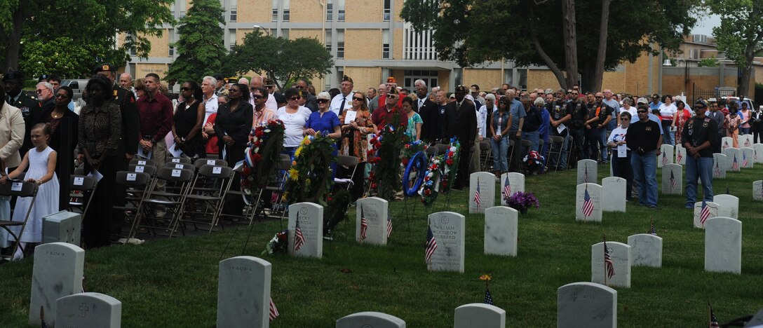 LANGLEY AIR FORCE BASE, Va. -- People from the local community visit the Hampton National Cemetery to watch a ceremony honoring fallen veterans May 25. The Memorial Day ceremony, held at the Hampton National Cemetery, honored service members who dedicated their lives to their country. (U.S. Air Force photo/Senior Airman Scott Aldridge)