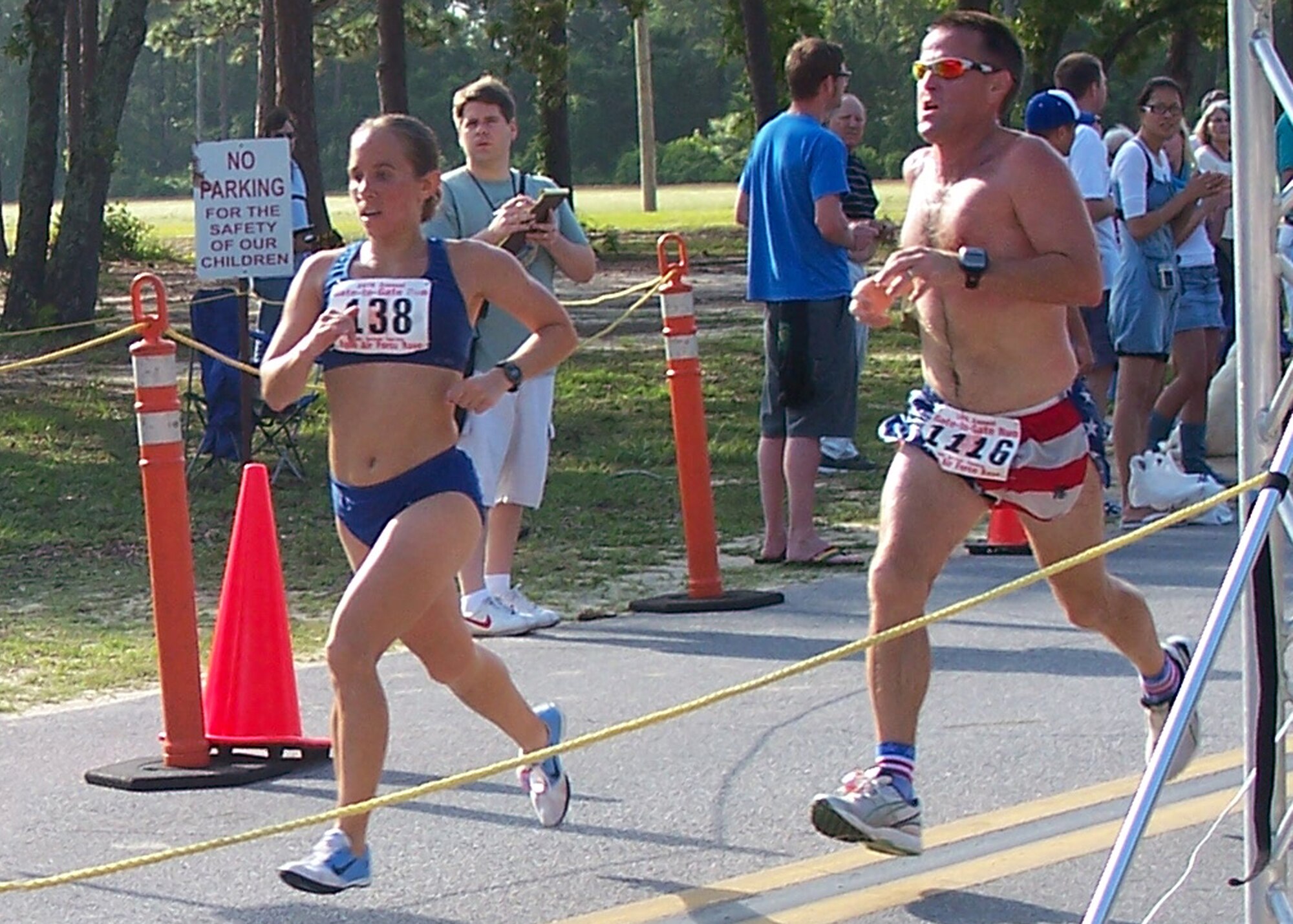 2nd Lt. Ilea Eskildsen, Defense Threat Reduction Agency, sprints to the finish during Eglin's Gate-2-Gate run May 25.  She finished first in the women's division in 27 minutes 24 seconds - a full minute ahead of her closest competition.  Lieutenant Eskildsen has a goal of competing in a distance running category in the Olympics someday.  (Courtesy photo by Anna Hallex.)